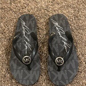 Women’s black Michael kors flip flops